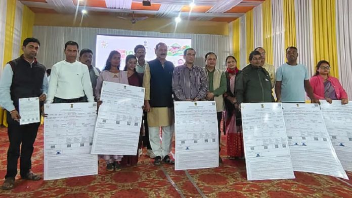 Landless Indigenous families in Assam receiving certificates for land ownership as part of the government’s Mission Basundhara program